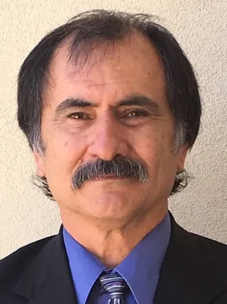 Gilbert Guadiana in suit with blue shirt